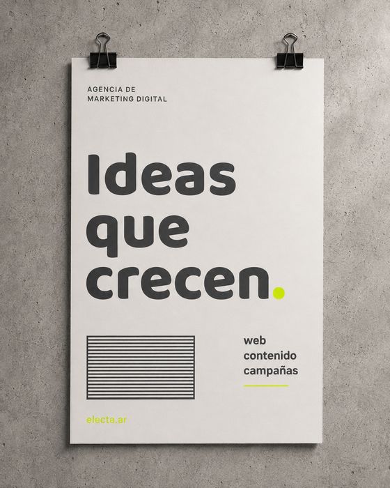 Afiche de Electa colgado en una pared de cemento: «Ideas que crecen. Web, contenido, campañas».